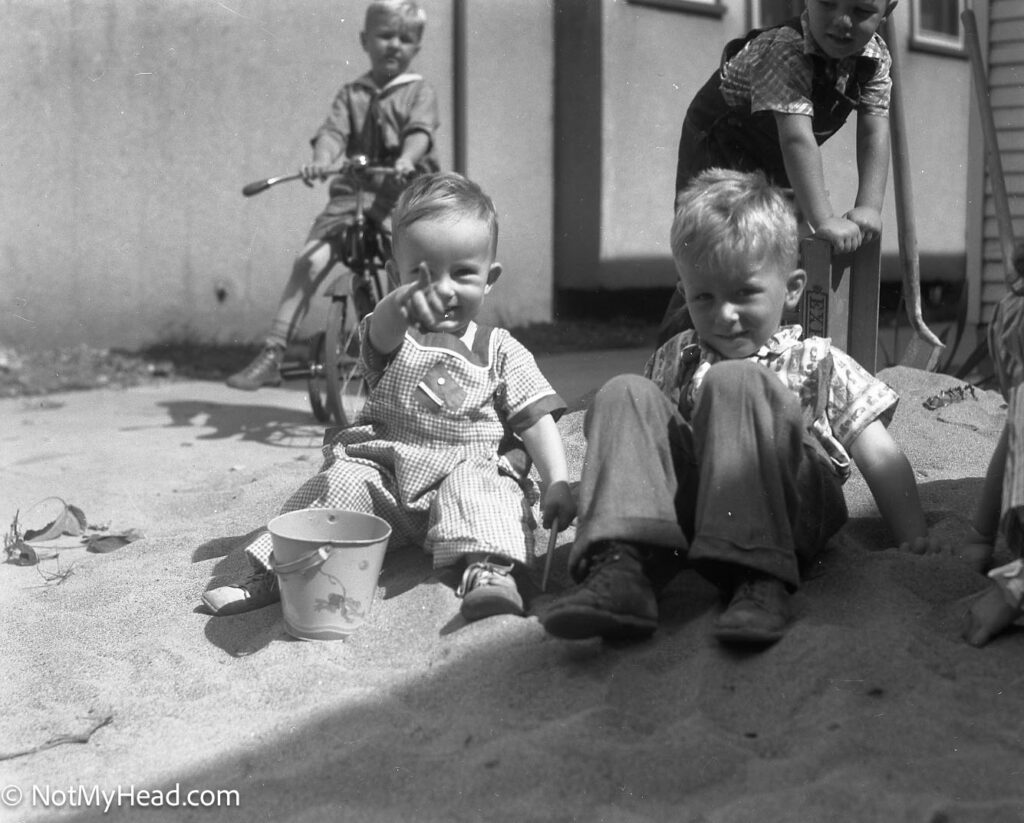 Photo of: In the Sandpile Sept 25, 1938 Nancy, Geedy & Gary  Date:  Location:    USA