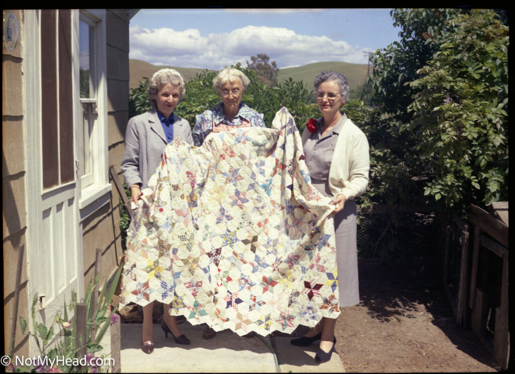 Photo of: Aunt Maggie and her famouse quilts. With Kate & Edith  Date: 1975 Location:    USA